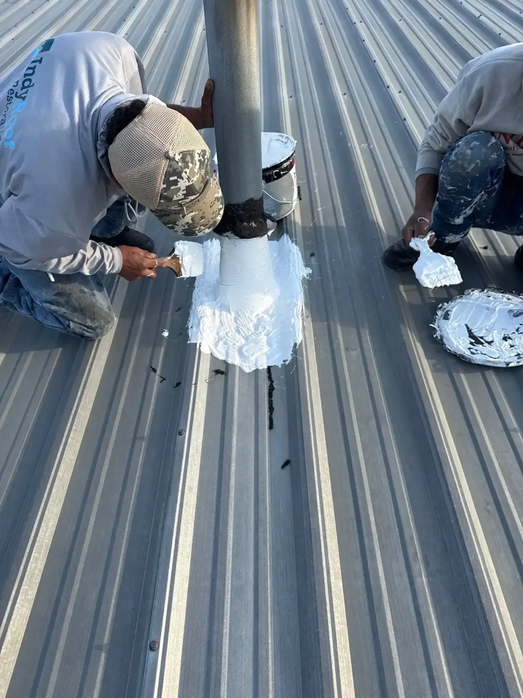 Tarping and dry-in on a Fall Creek Place commercial roof